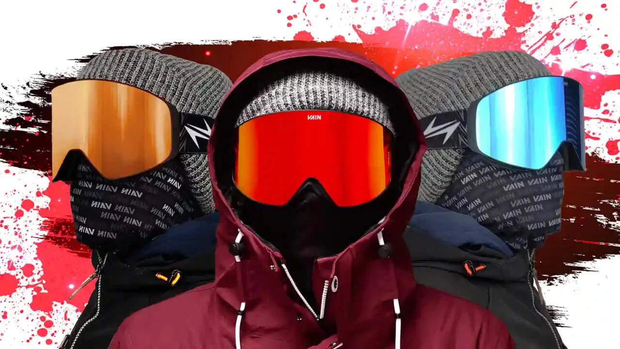 Three men wearing different color ski goggles
